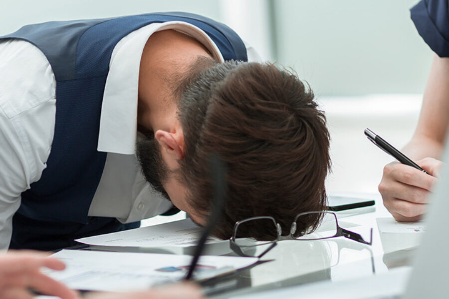 tired employee at a business meeting in the office. office weekdays